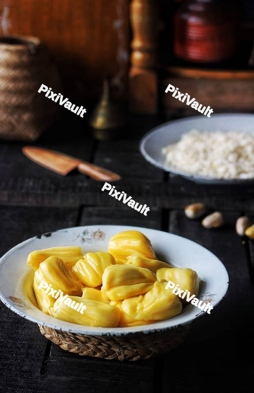 Fresh jackfruit slices on a white plate